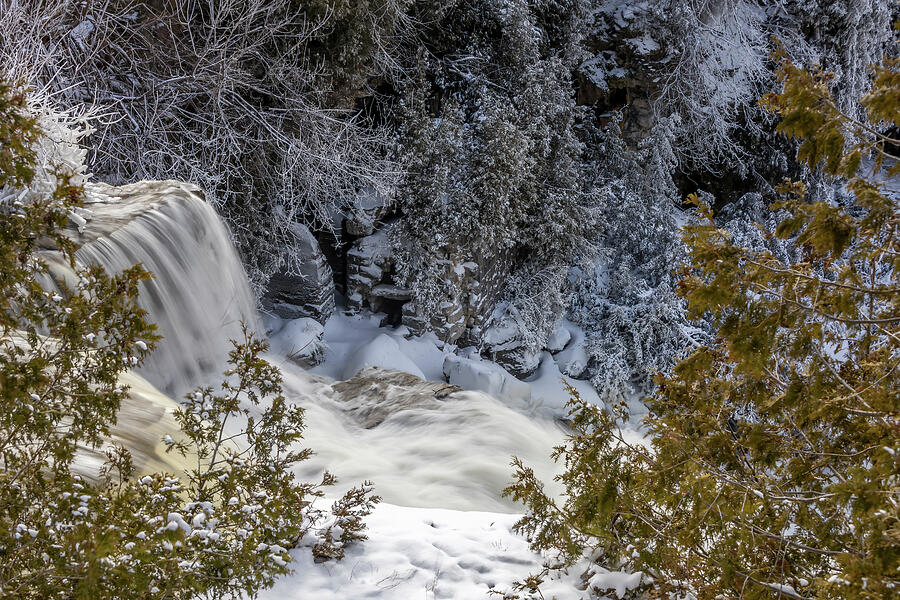 Photo of waterfall during the winter with snow