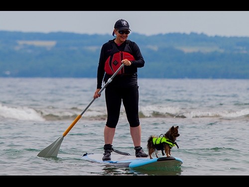 Paddleboarder with dog