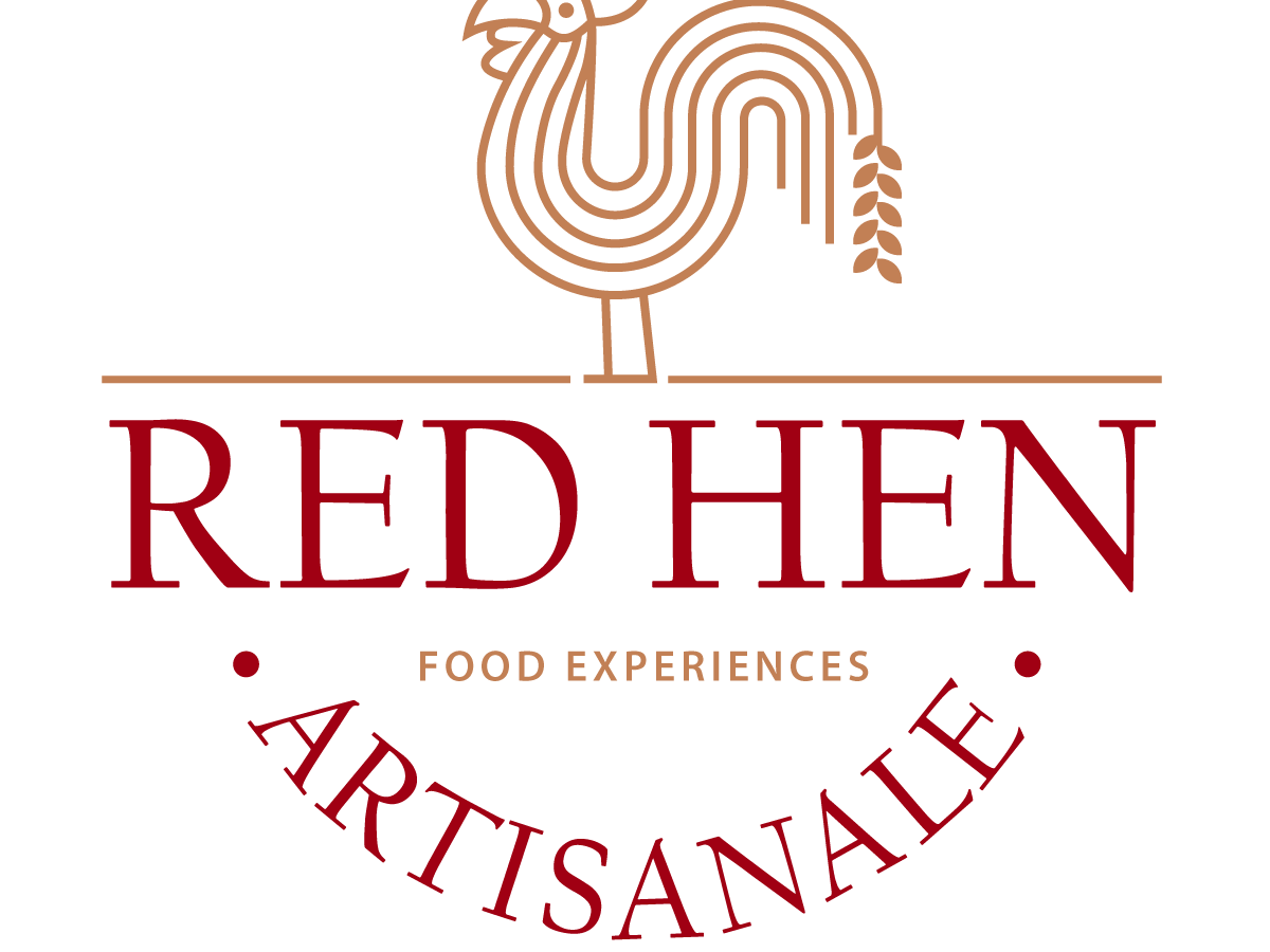 A golden hen with a wheat stalk for a tail, standing on top of the words "Red Hen Artisanale" - Food Experiences