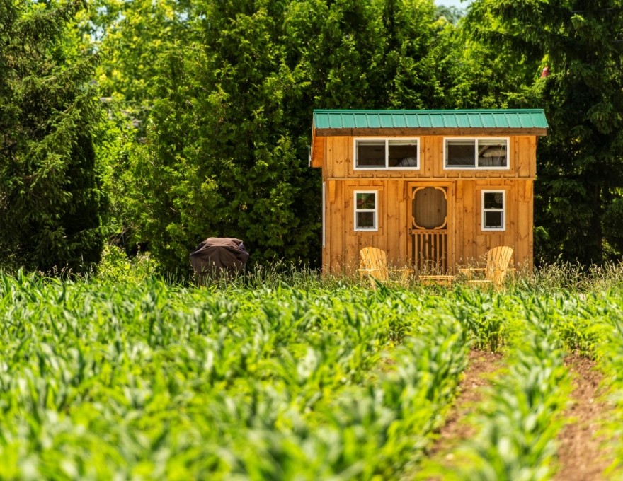 Full view exterior of cabin with field
