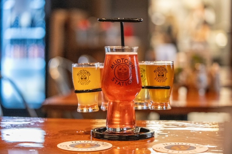A flight of beers on a table 