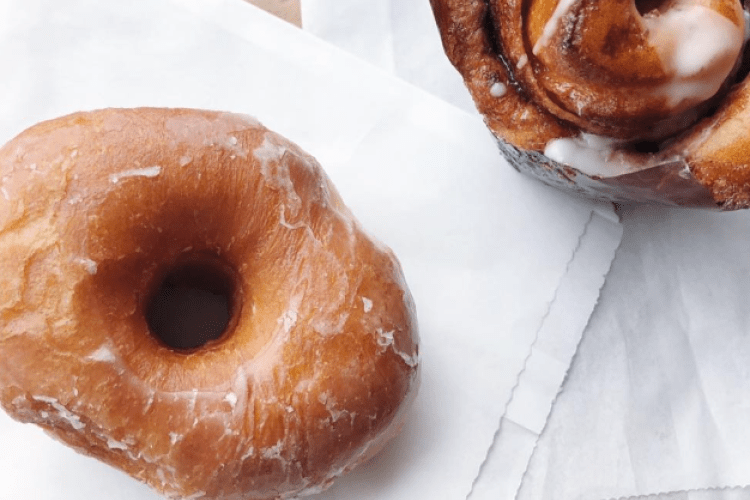 The Bakery of Flesherton cinnamon bun and donut on table