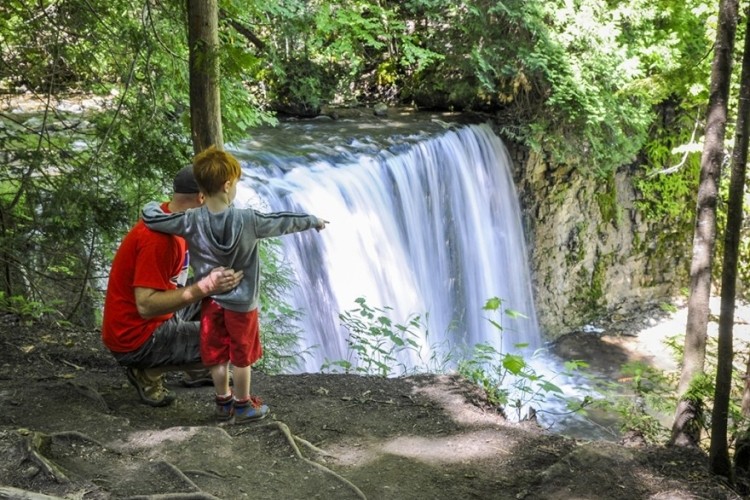HoggsFalls A kid and parent looking at waterfall