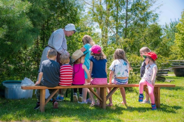 Moreston Heritage Village   Kids sitting at a picnic table