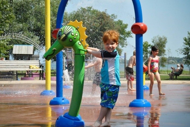 Good Cheer Splash Pad  Small kid running through Splash Pad