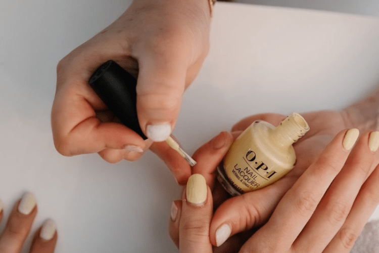 Someone getting their nails painted