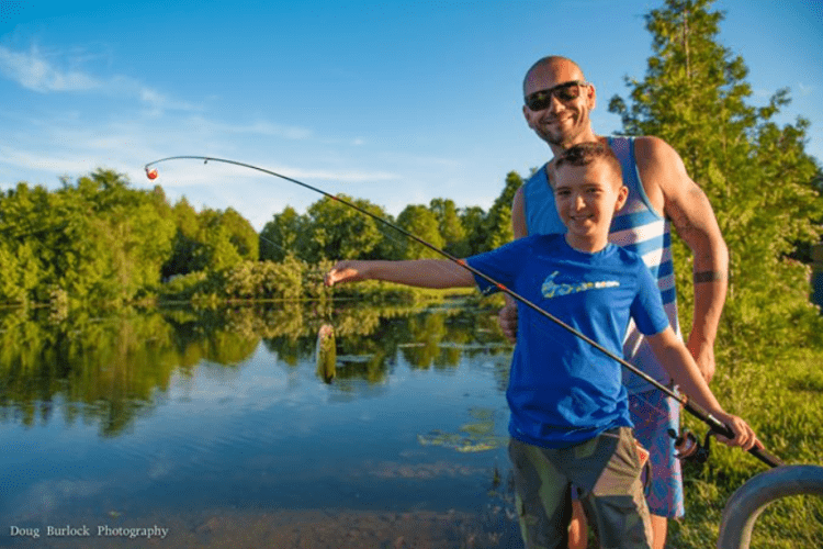 Saugeen Springs RV Park Dad with kid fishing