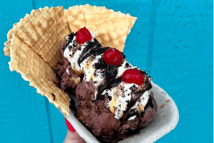 Someone holding a sundae