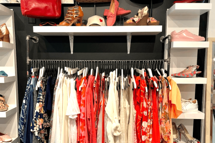 a rack of clothes in a boutique store