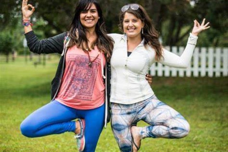 two girls doing yoga