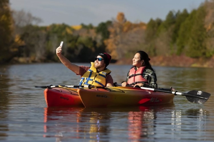 Two people on kayaks in water