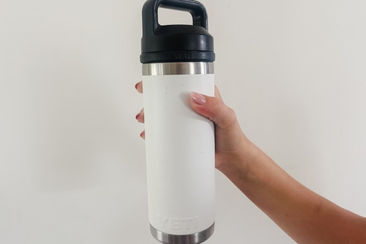 Someone holding reusable water bottle