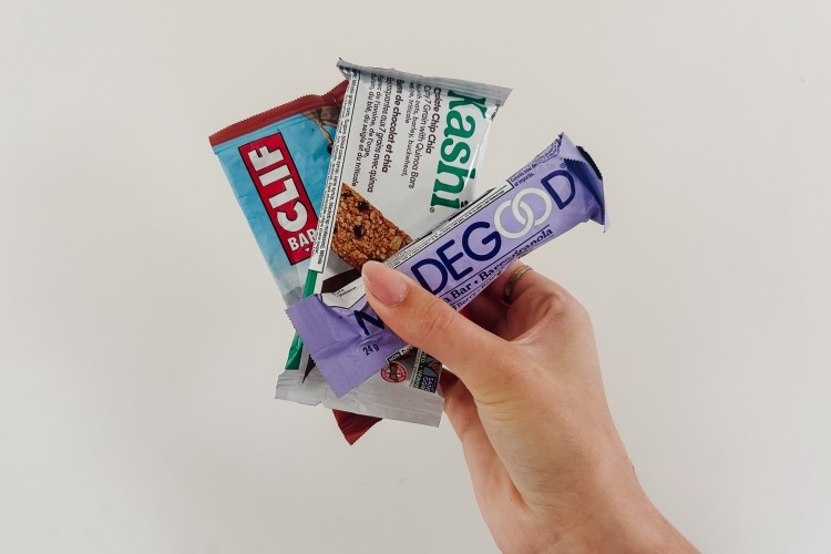 Someone holding granola bars