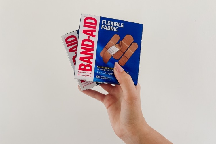 Someone holding Band-Aids