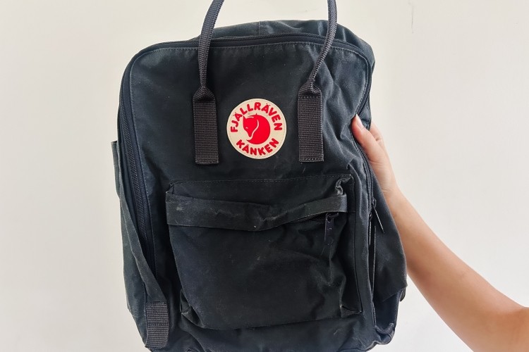 Someone holding a backpack