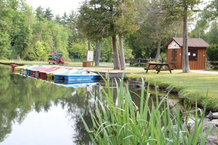 A river with a dock and boats