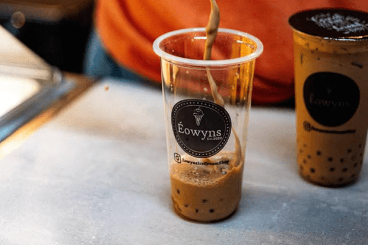 drink being poured into a cup