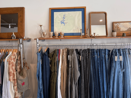 Rack at Curio with assorted clothing items