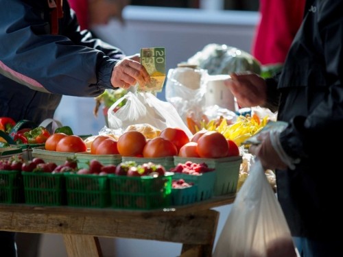 purchasing veggies at Owen Sound Farmers' Market