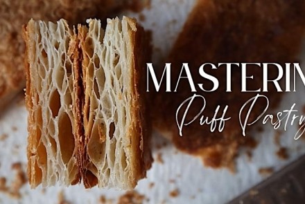 A cross-section of flaky puff pastry with the heading "Mastering Puff Pastry"