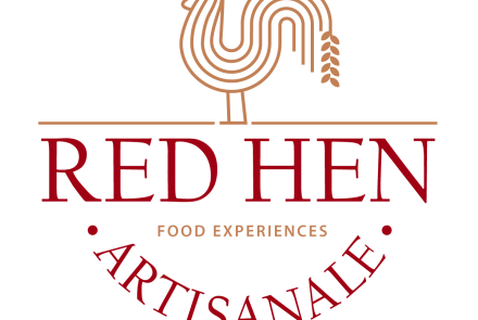 A golden hen with a wheat stalk for a tail, standing on top of the words "Red Hen Artisanale" - Food Experiences
