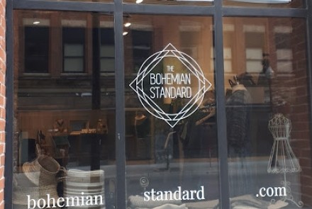 Exterior view of window with store logo stating name "The Bohemian Standard"