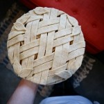 An unbaked pie, decorated with an angled lattice pattern