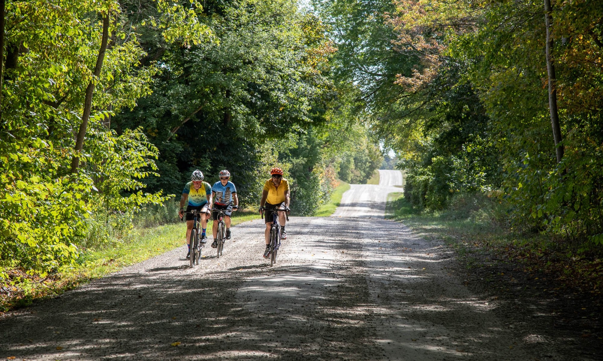 Three cyclists on Gravel Road