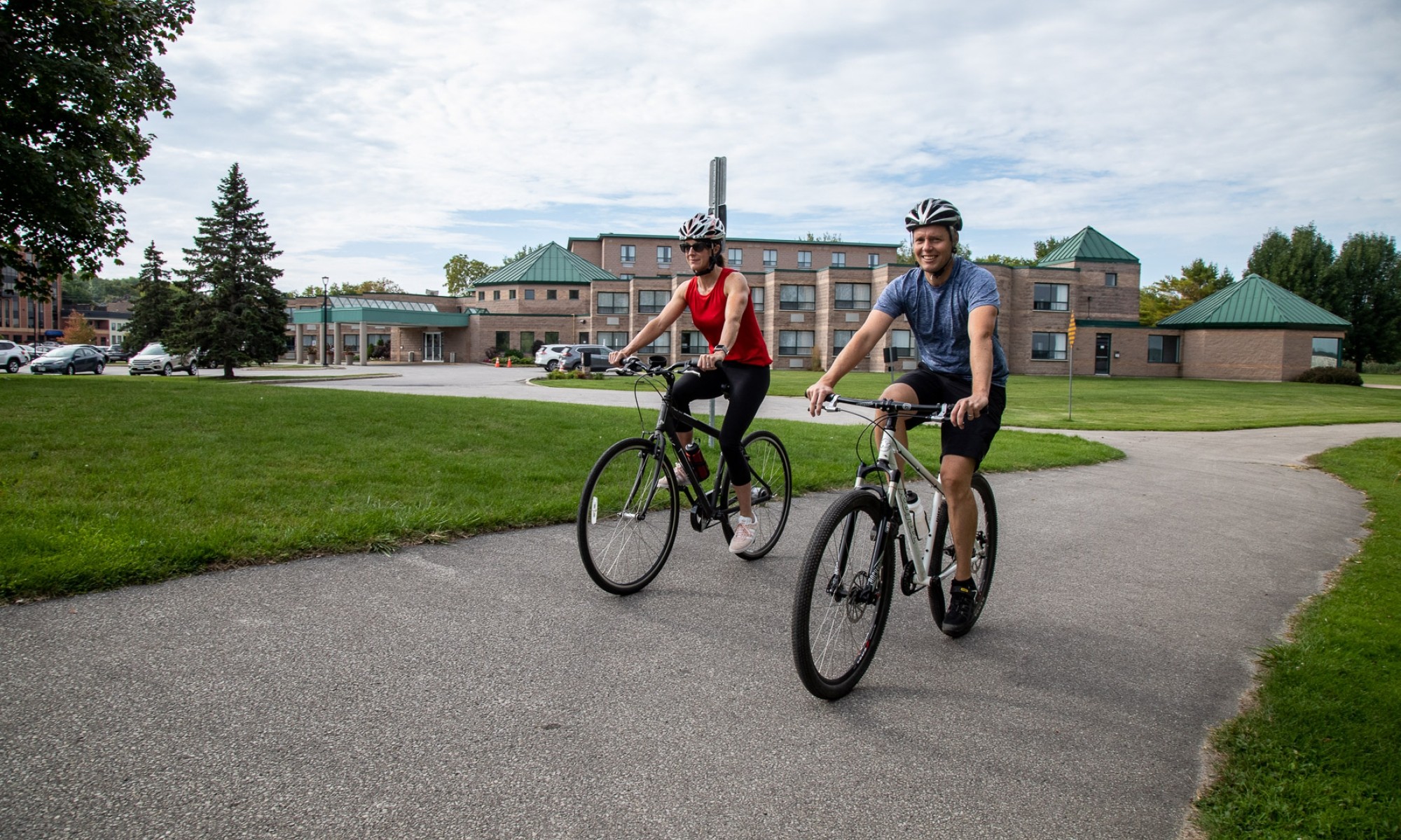 Female and Male riding a bike