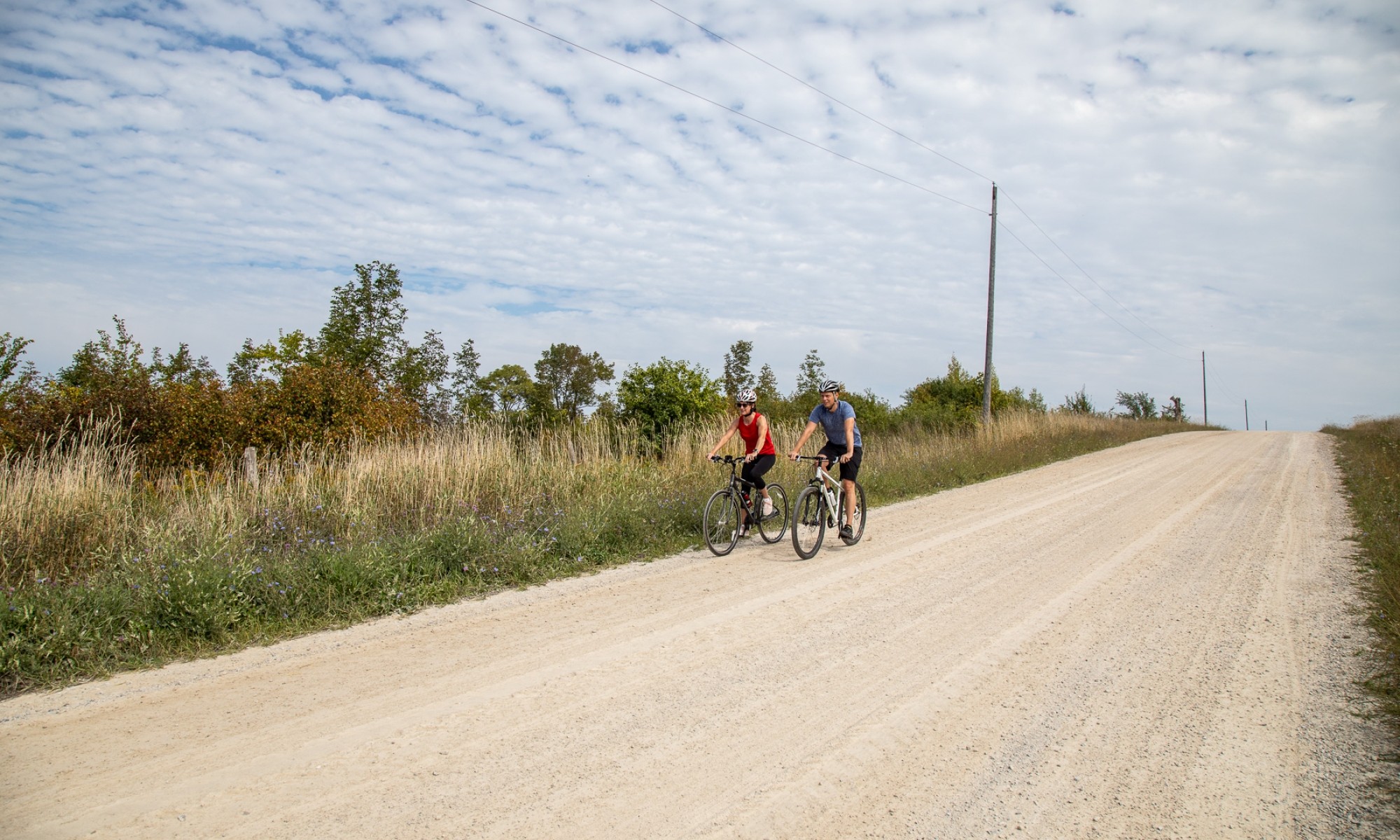 Two cyclists on a gravel road