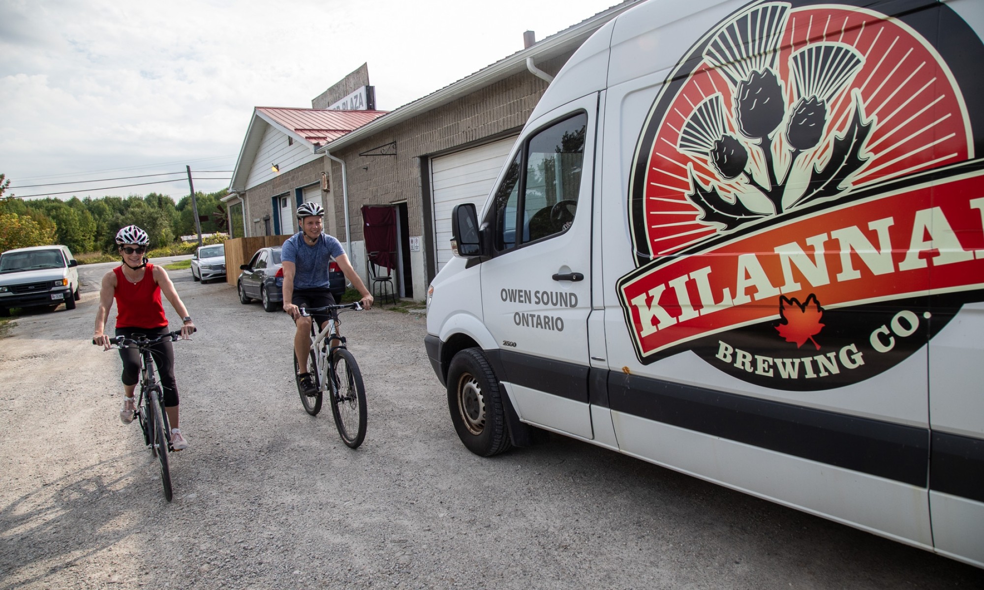 Two cyclists by Killanan truck