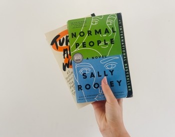 Someone holding books