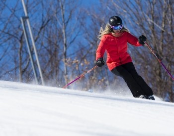 a woman downhill skiing