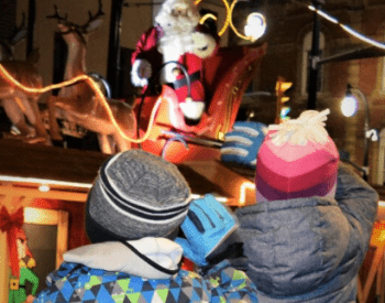 two kits watching santa 