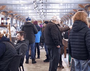 a crowd of people at a market 